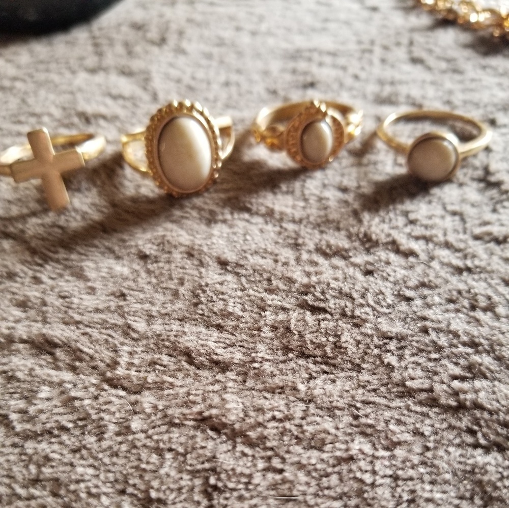 Set of 4 gold/ cream rings size 10